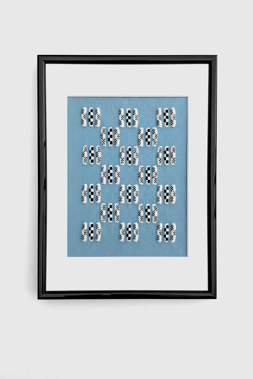 Framed artwork with text on a blue background