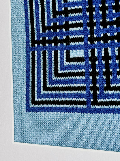 Close-up of a blue and black geometric patterned fabric